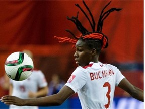 Canada defender Kadeisha Buchanan has bright red braids woven through her hair.