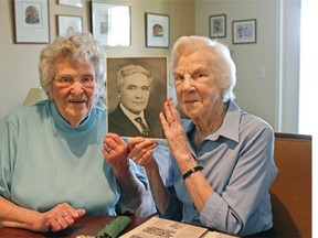 Charlotte Stuparek, left, youngest child of Andrew Leslie Horton, and Lois Horton, his daughter-in-law, hold a photograph of their illustrious ancestor, publisher of the Vegreville Observer for 52 years.