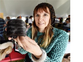 Cheryl Fennell with her seal wrist cuffs at Aboriginal Day Live in Louise McKinney Park in Edmonton on Saturday, June 20, 2015