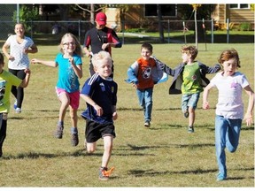 Children play games at a family barbecue held at Windsor Park Community League Hall.