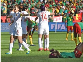 China celebrates defeating Cameroon 1-0 during round of 16 play at the FIFA Women’s World Cup at Commonwealth Stadium on Saturday, June 20, 2015.