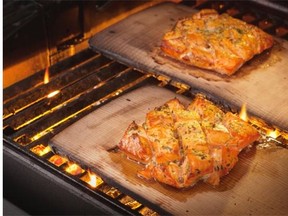 Citrus and vodka marinated cedar-planked salmon is a delicious option for a Father’s Day barbecue.