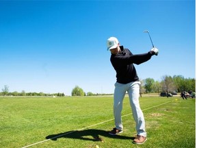 Cody Hancock of the Cardiff Golf & Country Club shows the proper form when hitting a knockdown shot in windy weather.