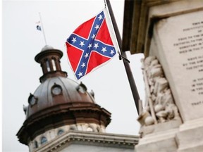 The Confederate flag flies on the Capitol grounds one day after South Carolina Gov. Nikki Haley announced that she will call for it to be removed on June 23, 2015 in Columbia, S.C. Debate over the flag was reignited after nine people were shot and killed during a prayer meeting at the Emanuel African Methodist Episcopal Church in Charleston, S.C.