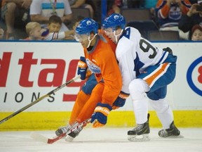 Connor McDavid and Darnell Nurse battle at the on-ice session of the 2015 orientation camp for young prospects within the Oilers organization for a six day rookie development camp in Edmonton. July 4, 2015.