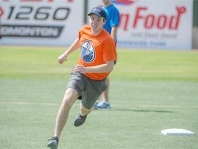 Connor McDavid rounds second headed for third base on a triple he hit at his second at bat. Edmonton Oilers Prospects and 12 members of the Edmonton Police Service played a charity softball game at Telus Field in Edmonton.