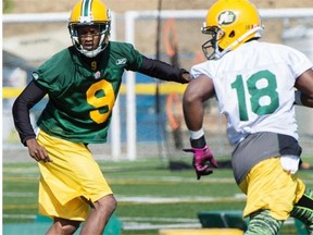 Cornerback Patrick Watkins, wearing No. 9 at left, takes part in a drill during Edmonton Eskimos training camp at Spruce Grove’s Fuhr Sports Park on June 15, 2015.
