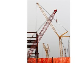 Cranes are a common sight in downtown Edmonton, aiding the construction of new condominium projects.