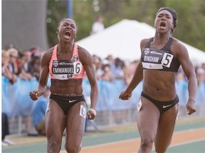 Crystal Emmanuel and Khamica Bingham cross the finish line in the women’s 100m final at the 2015 Canadian Track and Field Championships at Foote Field in Edmonton.