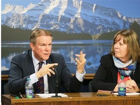 Dave Mowat (left, CEO, ATB Financial) and Marg McCuaig-Boyd (right, energy minister) talk about the Alberta government’s royalty review process at the Alberta Legislature on June 26, 2015. Mowat, on loan to the government from ATB Financial, will lead the review of Alberta’s royalty system.