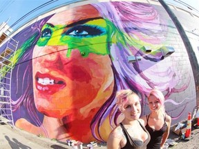 Edmonton artists Layla Folkmann and Lacey Jane are behind a gigantic new mural on the back of Varscona Hotel, with is part of the 20th anniversary of the Whyte Avenue Art Walk.