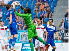 FC Edmonton’s Daryl Fordyce looks for a scoring opportunity in front of Atlanta Silverbacks goalkeeper Steward Ceus during a North American Soccer League game at Clarke Field on May 24, 2015.