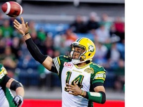 Edmonton Eskimos’ James Franklin (14) makes the pass against the Saskatchewan Roughriders during second half CFL pre-season action in Fort McMurray, Alta., on Saturday June 13. His play in Friday night’s pre-season game against the B.C. Lions will be one of the key things to watch.