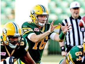 Edmonton Eskimos quarterback Matt Nichols reaches for the ball on a shotgun snap during Thursday’s Canadian Football League game against the Ottawa Redblacks at Commonwealth Stadium.