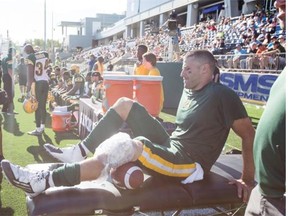 Edmonton Eskimos quarterback Mike Reilly ices his knee after being injured during second half CFL football action against the Toronto Argonauts in Fort McMurray on June 27, 2015.