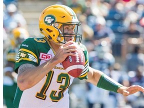 Edmonton Eskimos quarterback Mike Reilly (13) looks down field during first half CFL football action against the Toronto Argonauts in Fort McMurray, Alta., on Saturday, June 27, 2015.