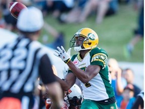 Edmonton Eskimos receiver Kenny Stafford hauls in a pass for a touchdown during a Canadian Football League pre-season game against the B.C. Lions in Vancouver on June 19, 2015.