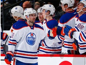 Edmonton Oilers defenceman Justin Schultz celebrates after scoring a goal against the Colorado Avalanche during an NHL game at Pepsi Center in Denver on March 30, 2015.