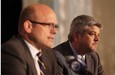 Edmonton Oilers president and general manager Peter Chiarelli, left, announces Todd McLellan as the NHL team’s new head coach on Tuesday.