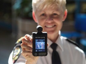 Edmonton Police Service deputy chief Danielle Campbell shows off a body camera that can be worn by an officer.