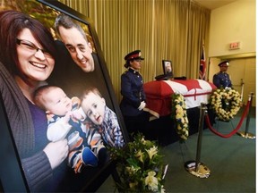 An Edmonton Police Service honour guard was on hand at the memorial for slain Const. Daniel Woodall at First Memorial Funeral Services on Sunday, June 14, 2015. The officer's funeral will be held Wednesday, June 17, 2015.