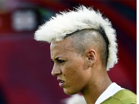 England’s forward Lianne Sanderson sports a platinum blond mohawk. The shaved sides help her keep her cool on the field.