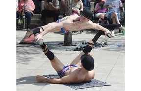The English Gents (Denis Lock and Hamish McCann) entertained the crowd with their hijinks during the Street Performers Festival in Churchill Square in Edmonton on Friday July 3, 2015.