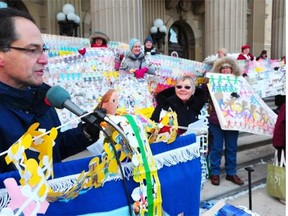 Alberta Finance Minister Joe Ceci was a Calgary co-ordinator of an action group to end poverty when he attended a rally on the steps of the legislature on Nov. 20, 2012. The event featured 70,000 paper dolls, each representing an Alberta child living in poverty.