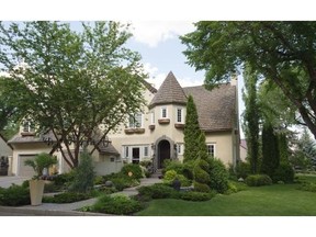 Two front doors and fairy tale-esque turret greet visitors at Jeff and Andrea Young’s 1936 heritage home in Highlands.