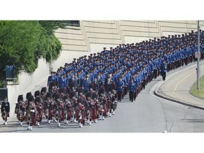 The funeral procession for Const. Daniel Woodall comes down Grierson Hill to the Shaw Conference Centre in Edmonton on Wednesday June 17, 2015.