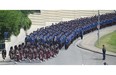 The funeral procession for Const. Daniel Woodall comes down Grierson Hill to the Shaw Conference Centre in Edmonton on Wednesday June 17, 2015.