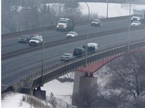 A haze of air pollution sits over Edmonton’s Capilano bridge as police check out a situation in this Jan. 20, 2010 file photo.