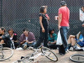 Homeless people try to stay cool across the street from the Boyle Street Co-Op on July 11, 2015. Temperatures hovered around 30 C degrees in the Edmonton region.