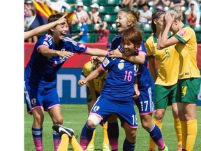 Japan’s #16 Mana Iwabuchi scores the only and game-winning goal against Australia’s Lydia Williams (1) in quarter-final FIfA soccer at Commonwealth Stadium in Edmonton, June 27, 2015.