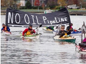 Kayakers display a “No Oil Pipeline” banner during a protest against the Enbridge Northern Gateway pipeline in Vancouver, in this Nov. 16, 2013 file photo.