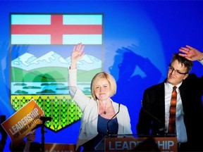 NDP leader Rachel Notley, left, and her husband Lou Arab react onstage after Notley was elected Alberta’s new premier on May 5, 2015.