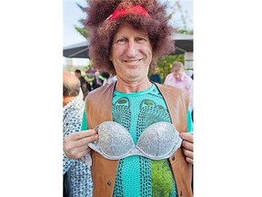 Michael Webb, president of MacLachlan Mitchell Homes, shows off the bra he paid $120 for at Pinot of the Patio at the Royal Glenora Club.