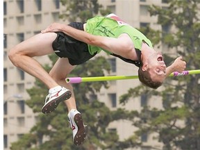 Mike Mason of Canada knocks the bar in the men’s high jump competition during the Track Town Classic at Foote Field in Edmonton on July 12, 2015. Mason now travels to Toronto to compete at the Pan American Games.