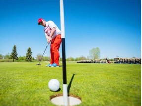 Mike McEvay, head pro at Goose Hummock Golf Resort, teaches long distance control while putting on the green at the Cardiff Golf & Country Club.