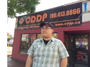 Mike Wong, co-owner of Chicago Deep Dish Pizza in Old Strathcona, says while he agrees with strict guidelines for signs in the historic area, the small business needs time to comply.
