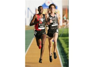 Mohammed Ahmed (left) and Cameron Levins (right) race to the finish in the Men 5000 Meter Run Senior event at the Canadian Track & Field Championships in Edmonton on July 2, 2015. Levins won the race and Ahmed came in second place.