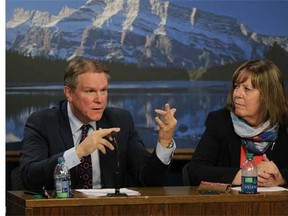 Dave Mowat, left, president and CEO of ATB Financial, and Alberta Energy Minister Marg McCuaig-Boyd  talk about the Alberta government's royalty review process on June 26, 2015.