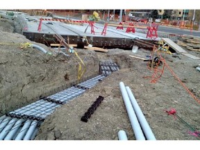 A lower grade pipe was still being installed in front of the Polish Hall, despite a decision to use higher quality pipe.