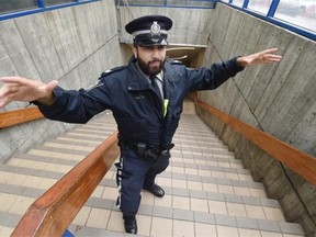 Peace officer Halley Barrantes does some rapping in the Churchill Station LRT entrance in Edmonton on Saturday, June 13, 2015.