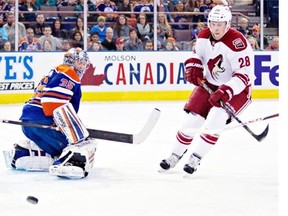 Phoenix Coyotes’ Lauri Korpikoski is stopped by Edmonton Oilers goalie Nikolai Khabibulin during first period NHL hockey action at Rexall Place in February 2013.