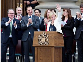 Rachel Notley is applauded after being sworn in as Alberta’s 17th premier on Sunday, May 24, 2015 at the legislature in Edmonton. The premier should be acknowledged for a perfectly gendered cabinet and a team of mostly female staffers, writes Joanne Cave.