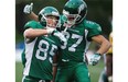 Saskatchewan’s Alex Pierzchalski (85) celebrates a touchdown with teammate Alex Carroll (87) against the Edmonton Eskimos during pre-season CFL action in Fort McMurray on June 13, 2015. The Eskimos won the Northern Kickoff 31-24.