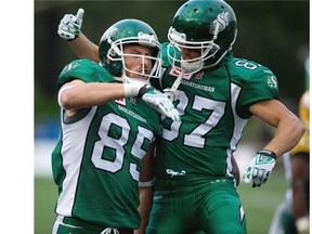 Saskatchewan’s Alex Pierzchalski (85) celebrates a touchdown with teammate Alex Carroll (87) against the Edmonton Eskimos during pre-season CFL action in Fort McMurray on June 13, 2015. The Eskimos won the Northern Kickoff 31-24.