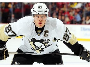 Sidney Crosby of the Pittsburgh Penguins gets ready to take a faceoff against the New Jersey Devils during an NHL game at the Prudential Center in Newark, N.J., on Jan. 30, 2015.