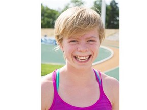 Sophie Sigfstead, a 14-year-old middle distance runner, is clocking times in the 800 M that would make her competitive in the under-17 age category — if she was eligible for international competition in that category. Sophie is training with Edmonton Harriers coach Phil Booth in advance of the provincial track championships this weekend in Edmonton. June 18, 2015.